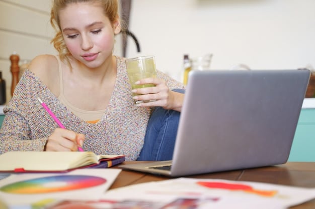 A student studying with textbooks and a laptop, highlighting the concept of self-education and professional development.