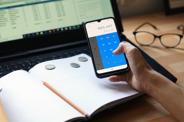 A close-up shot of hands using a budgeting app on a smartphone, with graphs showing income and expenses clearly visible on the screen.