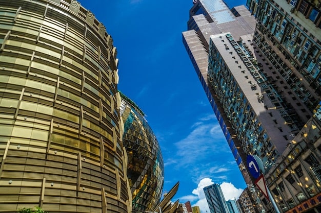 A photo of the Reserve Bank of Australia building in Sydney, with a blurred background of the city skyline. The image conveys the central role of the RBA in implementing monetary policy.